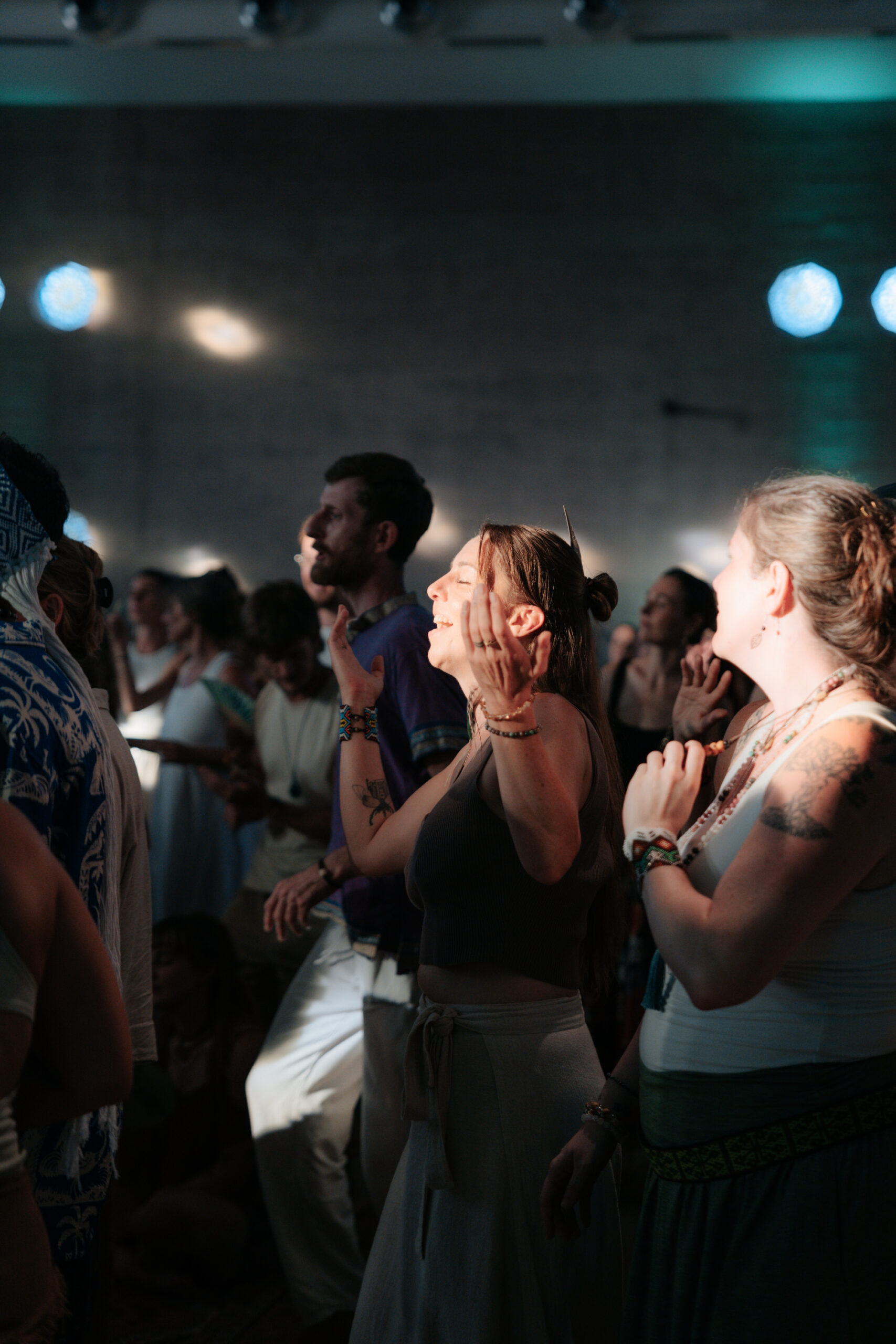a group of people dancing during a conscious festival
