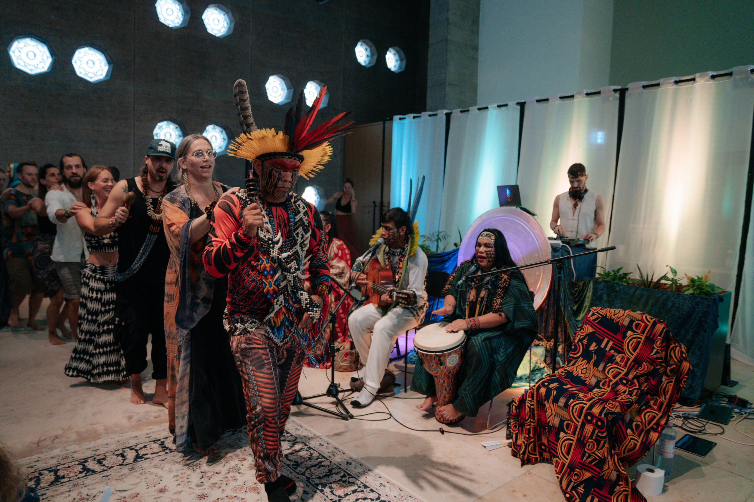 a group of people dancing during a conscious festival